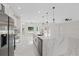Gourmet kitchen featuring a large marble island, modern fixtures, and stainless appliances at 7372 Madrid Rd, Weeki Wachee, FL 34613