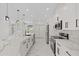 Modern kitchen featuring white marble countertops, stainless steel appliances, and ample cabinet space at 7372 Madrid Rd, Weeki Wachee, FL 34613