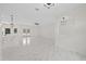 Spacious living area showcasing elegant, reflective marble floors and modern lighting at 7372 Madrid Rd, Weeki Wachee, FL 34613
