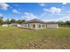 Expansive backyard featuring a large covered patio at 7372 Madrid Rd, Weeki Wachee, FL 34613