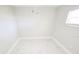 White bedroom with tiled floors and a ceiling fan at 7740 Sagebrush Dr, Port Richey, FL 34668