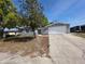 Well-maintained single-story home with a one car garage, concrete driveway, and landscaped front yard at 7740 Sagebrush Dr, Port Richey, FL 34668