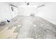 Spacious garage with ample room for storage and projects; ready for personalization at 7740 Sagebrush Dr, Port Richey, FL 34668