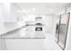 Bright kitchen with stainless steel appliances, granite countertops, subway tile backsplash, and ample cabinet space at 7740 Sagebrush Dr, Port Richey, FL 34668