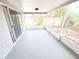 Bright and airy sunroom with screen windows and sliding glass doors to the backyard at 7740 Sagebrush Dr, Port Richey, FL 34668