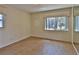 Bedroom featuring two windows, mirror, and neutral color walls at 7802 N 53Rd St, Tampa, FL 33617
