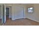 Bedroom featuring a window, closet with sliding doors, and doorway at 7802 N 53Rd St, Tampa, FL 33617
