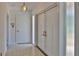 Inviting entryway featuring neutral walls, patterned flooring, and a unique double-door entrance at 7802 N 53Rd St, Tampa, FL 33617