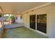 Covered patio with a sliding glass door entrance and view of the backyard at 7802 N 53Rd St, Tampa, FL 33617