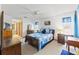 Comfortable bedroom with carpet, ceiling fan, natural lighting, and classic wooden furniture at 8195 Wooden Dr, Spring Hill, FL 34606