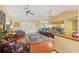 Open living space showcasing hardwood floors, recessed lighting, vaulted ceilings, and a comfortable seating arrangement at 8195 Wooden Dr, Spring Hill, FL 34606