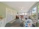 Sunroom with multiple windows, a ceiling fan, and comfortable seating, creating a bright and inviting space at 8195 Wooden Dr, Spring Hill, FL 34606