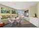 Sunroom with multiple windows, a small table and four chairs at 8195 Wooden Dr, Spring Hill, FL 34606