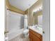 Cozy bathroom with a shower-tub combo and a single sink vanity at 8603 Sandy Plains Dr, Riverview, FL 33578