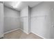 Walk-in closet featuring metal shelving and carpet flooring at 8603 Sandy Plains Dr, Riverview, FL 33578