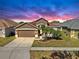 Charming single-story home with landscaped front yard and attached two-car garage at 8603 Sandy Plains Dr, Riverview, FL 33578