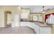 Spacious kitchen with tiled floors, modern appliances, and breakfast bar for casual dining at 8603 Sandy Plains Dr, Riverview, FL 33578