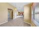 Bright kitchen with tile flooring, neutral walls, white appliances, and eat-in area bathed in natural light at 8603 Sandy Plains Dr, Riverview, FL 33578