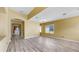 Spacious living room features wood-look floors and lots of natural light at 8603 Sandy Plains Dr, Riverview, FL 33578