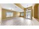 Spacious living room showcases wood-look floors, neutral wall color, and lots of natural light at 8603 Sandy Plains Dr, Riverview, FL 33578