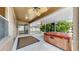 Screened-in porch featuring a hot tub, ceiling fans, and ample space at 8603 Sandy Plains Dr, Riverview, FL 33578
