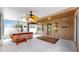 Screened-in porch featuring a hot tub, ceiling fans, and ample space at 8603 Sandy Plains Dr, Riverview, FL 33578