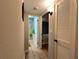 Hallway view leading to a bedroom and bathroom with an open floor plan at 8651 10Th N St # 236, St Petersburg, FL 33702
