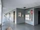 Clean, brightly lit hallway with mailboxes, elevator, and safety features in a 55+ community at 8651 10Th N St # 236, St Petersburg, FL 33702
