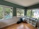 Brightly lit workout room with multiple windows overlooking pool area and exercise equipment at 8651 10Th N St # 236, St Petersburg, FL 33702