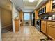 A spacious kitchen with light wood cabinets, stainless appliances, and plenty of countertop space at 8651 10Th N St # 236, St Petersburg, FL 33702
