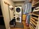 Conveniently placed laundry room with stacked washer/dryer combo and closet for laundry items at 8651 10Th N St # 236, St Petersburg, FL 33702