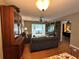 Well lit living room with furniture, adjacent to a sunroom at 8651 10Th N St # 236, St Petersburg, FL 33702