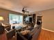 Comfortable living room featuring a ceiling fan and a view into the sunroom and bedroom at 8651 10Th N St # 236, St Petersburg, FL 33702