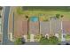 Aerial shot of the backyard and pool, showcasing the neighborhood pond at 10007 Coldwater Loop, Land O Lakes, FL 34638