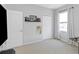 Bedroom featuring a window with curtains, a closet, and wall decorations, offering a comfortable living space at 10007 Coldwater Loop, Land O Lakes, FL 34638