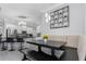 Bright breakfast nook with a built-in bench and a modern light fixture near the kitchen at 10007 Coldwater Loop, Land O Lakes, FL 34638