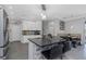 Stylish kitchen with granite countertops, a center island, white cabinets and stainless appliances at 10007 Coldwater Loop, Land O Lakes, FL 34638