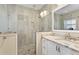 Modern bathroom featuring glass shower with stone floor and vanity with granite countertop at 102 Adriatic Ave, Tampa, FL 33606
