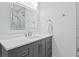 Elegant bathroom with gray vanity, white countertop, and sleek fixtures providing a modern feel at 102 Adriatic Ave, Tampa, FL 33606