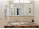 Bathroom with a beautiful granite countertop and updated finishes at 102 Adriatic Ave, Tampa, FL 33606