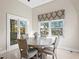 Cozy breakfast nook with round table and a bay window at 102 Adriatic Ave, Tampa, FL 33606
