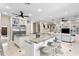 Spacious kitchen with marble countertops, a large island, stainless steel appliances, and breakfast bar at 102 Adriatic Ave, Tampa, FL 33606