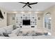 Bright living room with custom built-in shelving and a comfortable seating area at 102 Adriatic Ave, Tampa, FL 33606