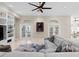 Comfortable living room featuring neutral decor, an art display, and French doors to the backyard at 102 Adriatic Ave, Tampa, FL 33606