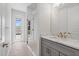 Bathroom featuring a glass-enclosed shower, a door to the patio, and a vanity at 10493 Grail Ave, Englewood, FL 34224