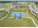 Aerial view of community basketball court with pavilion, showcasing the recreational amenities and green spaces at 10816 Wendover Dr, Palmetto, FL 34221
