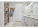 Modern bathroom with a glass shower, granite countertops, and sleek fixtures at 10816 Wendover Dr, Palmetto, FL 34221