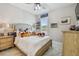 Bright bedroom features a comfortable bed with stuffed animals and a window providing natural light at 10816 Wendover Dr, Palmetto, FL 34221