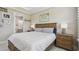 Comfortable bedroom featuring a decorative ceiling, natural light, and an ensuite bathroom at 10816 Wendover Dr, Palmetto, FL 34221
