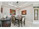 Charming dining room with modern lighting and decorative wall art at 10816 Wendover Dr, Palmetto, FL 34221